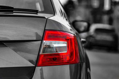 View of red car on street