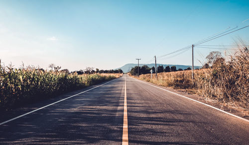 Empty road against sky