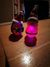 Close-up of illuminated christmas lights on table at home