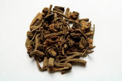 Close-up of bread in plate against white background