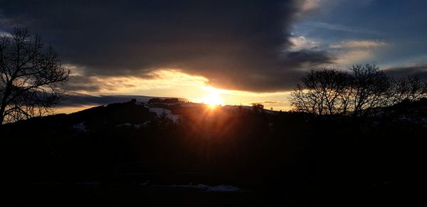 Scenic view of silhouette landscape against sky during sunset