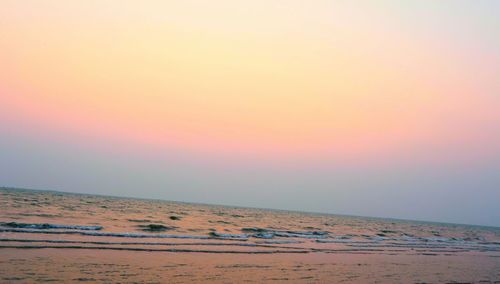 Scenic view of beach against sky during sunset