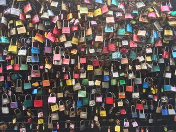 Full frame shot of padlocks hanging on railing