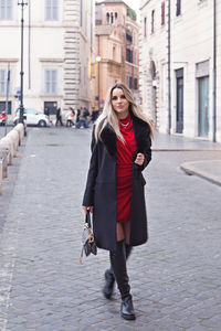 Portrait of woman walking on street