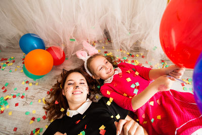 Portrait of smiling girl with balloons