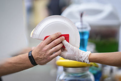 Close-up of hand holding ice cream