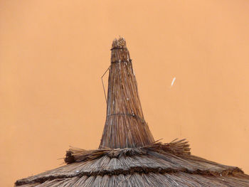 Low angle view of roof against sky during sunset