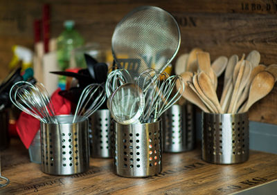 Close-up of kitchen utensils on table