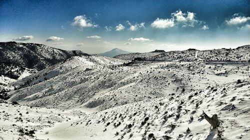 Scenic view of snowcapped mountains against sky