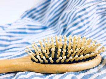 Close-up of comb on towel