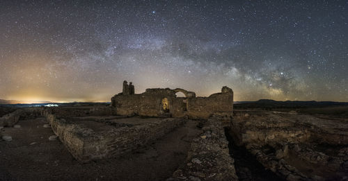 Old building against sky at night