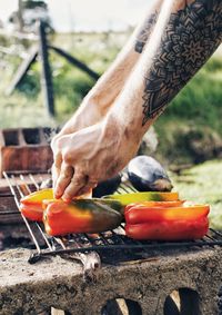 Close-up of man preparing food