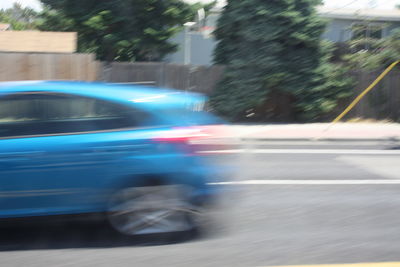 Blurred motion of car on road