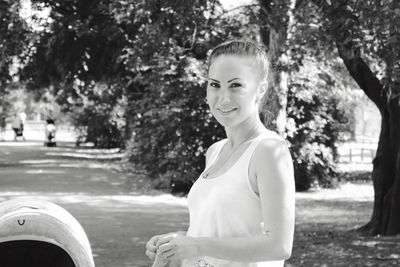 Portrait of young woman in park