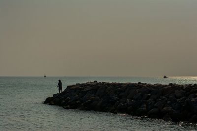 Scenic view of sea against clear sky during sunset