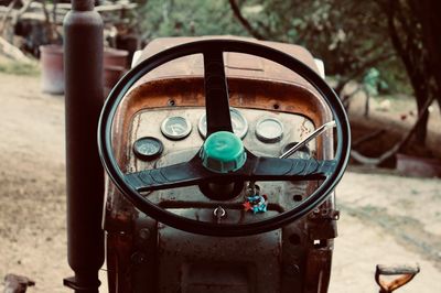 Close up view of the steering wheel of a truck from the driver seat.