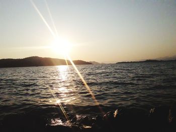 Scenic view of sea against clear sky during sunset