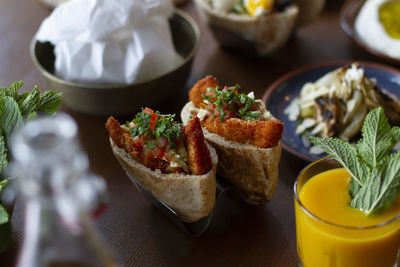 Chicken schnitzel in pita bread with dips