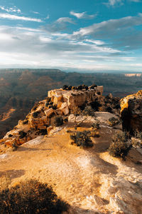 Rock formations on landscape against sky