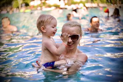 Portrait of boy swimming in pool