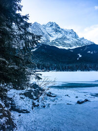 Scenic view of snowcapped mountains against sky