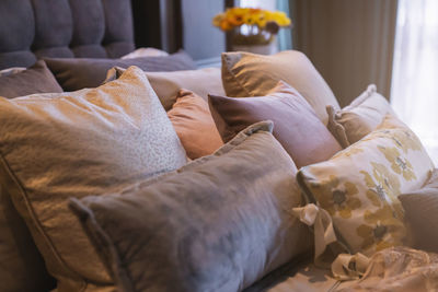 Close-up of sofa on bed at home