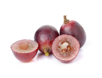 Close-up of fruits against white background