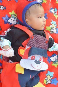 Portrait of cute baby boy with toy