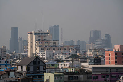 Buildings in city against sky