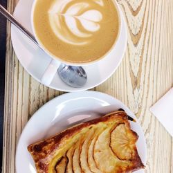 Directly above shot of cappuccino served on table