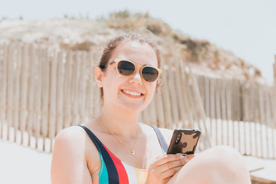 Young woman using mobile phone