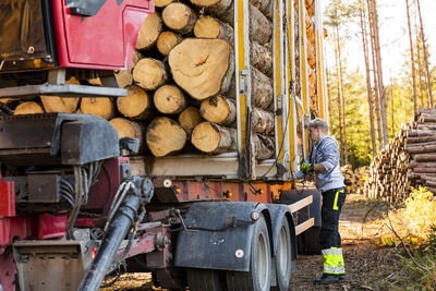 Man checking load on trailer