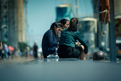 Young couple sitting outdoors