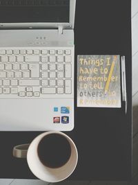 Directly above shot of coffee cup on table