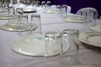 Empty drinking glasses on table in restaurant