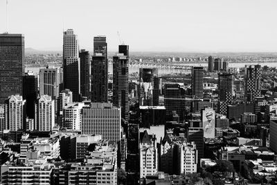 Aerial view of modern buildings in city against sky