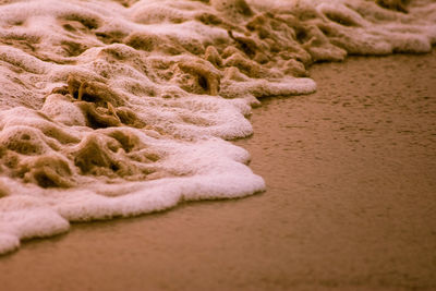 Close-up of sand at beach