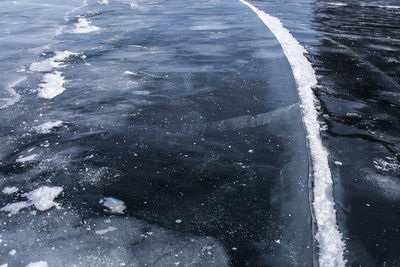 High angle view of snow on sea