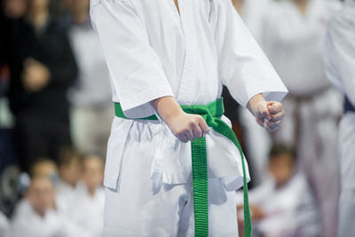 Midsection of man practicing karate 