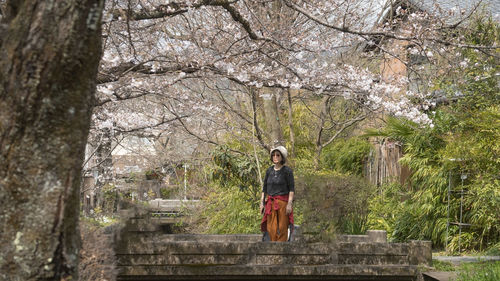 Full length of woman walking on tree