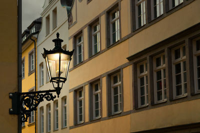 Illuminated gas light on building