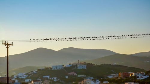 Scenic view of mountains against clear blue sky