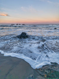 Scenic view of sea against sky during sunrise