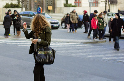 People walking in street in city