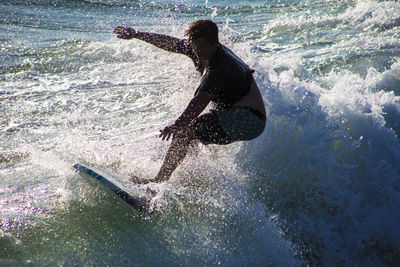 Side view of woman in sea