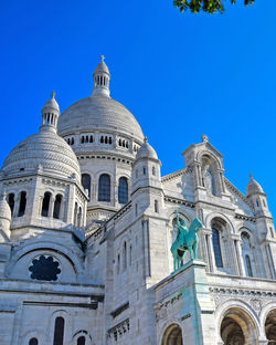 Low angle view of building against blue sky