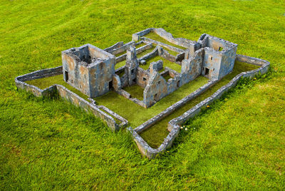 High angle view of old ruin on field