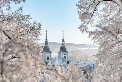 Panoramic shot of building against sky during winter