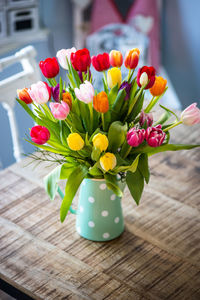 Close-up of tulips in vase on table, country style