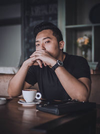 Portrait of man sitting in cafe